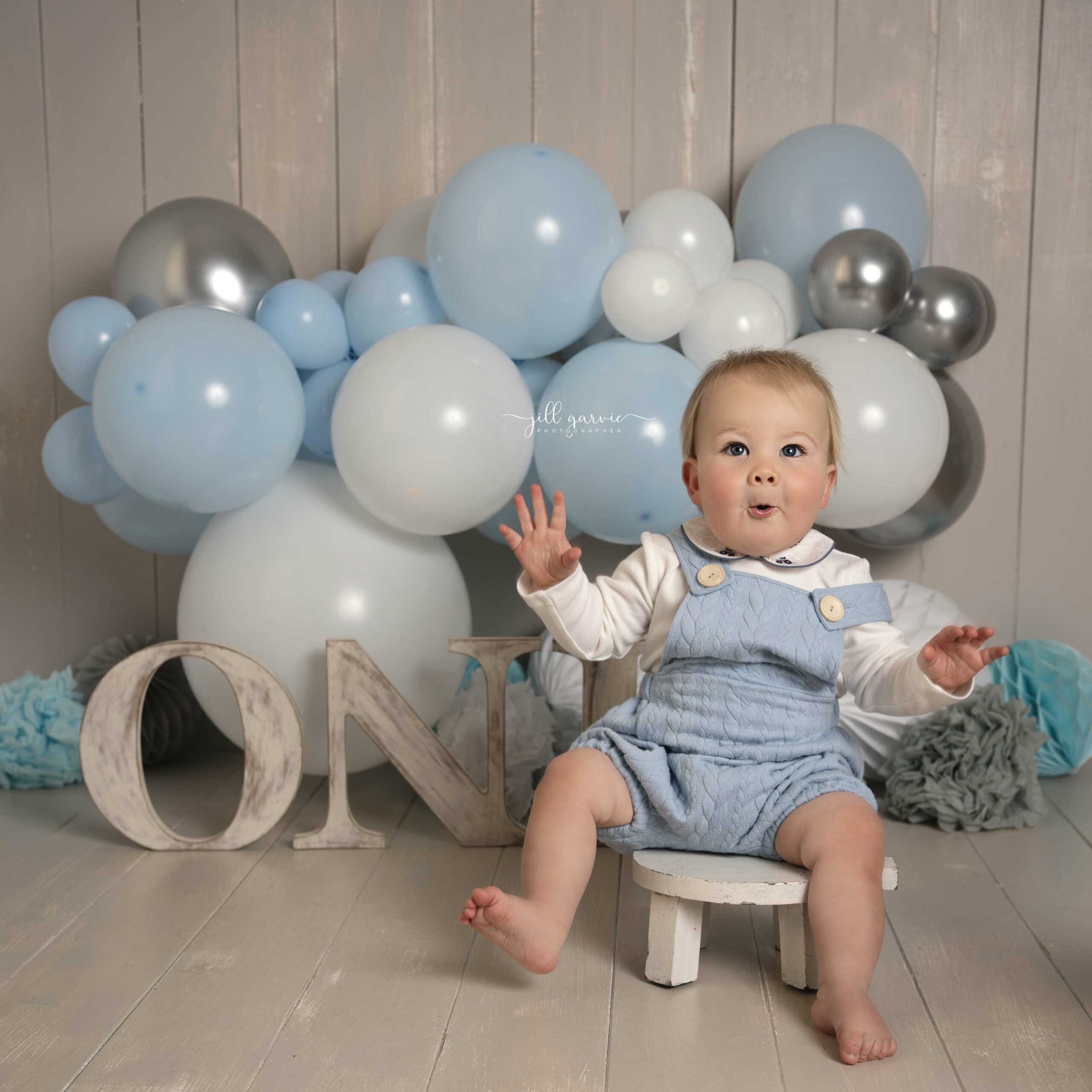 Birthday boy with blue balloons