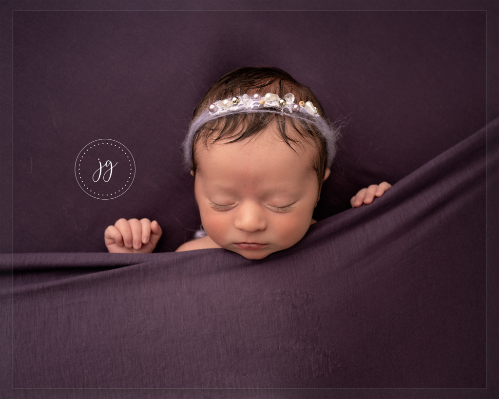 Newborn baby girl sleeping at her Photoshoot with Edinburgh based Photographer Jill Garvie